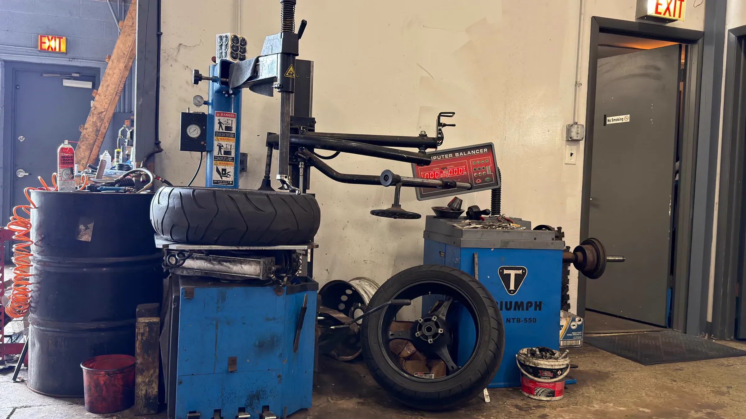 Motorcycle tire changer and computer wheel balancer at TT Sport Garage
