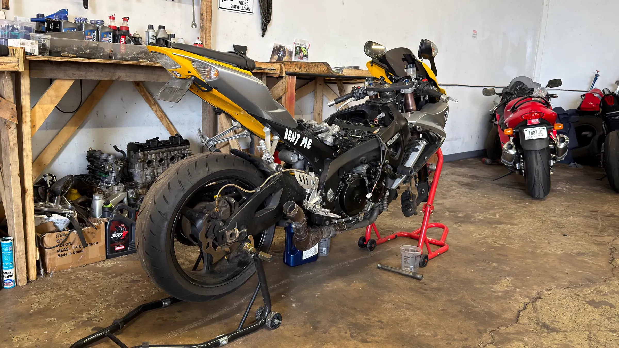 Sportbike stripped down for an engine rebuild on paddock stands at TT Sport Garage